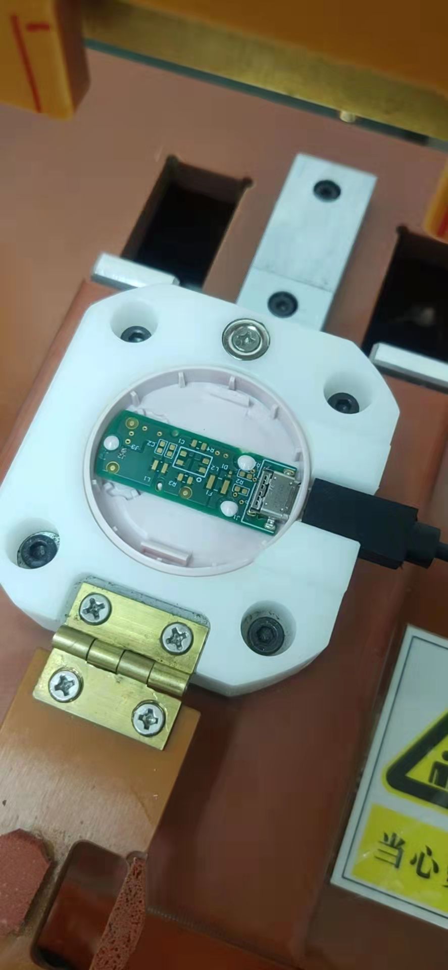 PCB with USB-C port in housing fixture